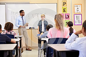 Schoolboy presenting to his elementary school classmates