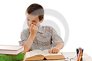 Schoolboy reading a book