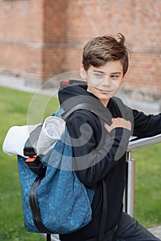 Schoolboy with school backpack. Back to school. Teenagers leisure