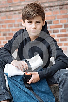 Schoolboy with school backpack. Back to school. Teenagers leisure