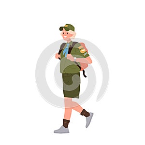 Schoolboy scout in uniform carrying backpack smiling and walking isolated on white background