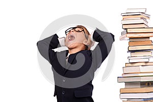 Schoolboy screaming near the huge stack of books