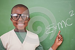 Schoolboy showing the the mass-energy equivalence formula photo