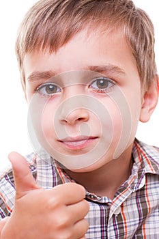 Schoolboy showing numbers with hand