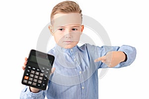 Schoolboy shows at calculator. Portrait of funny cute 10s boy .White background