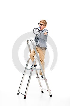 Schoolboy on stepledder with loudspeaker