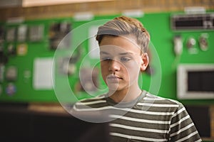 Schoolboy studying in computer classroom