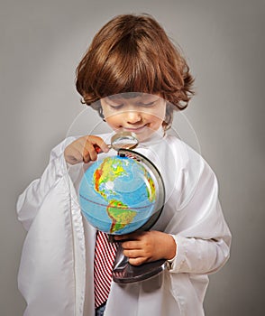 Schoolboy studying Globe