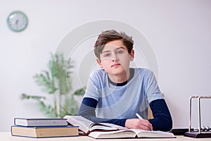 Schoolboy studying physics at home