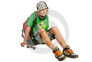 Schoolboy teen waiting on skateboard