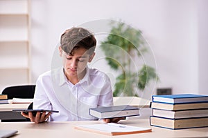 Schoolboy in tele-education concept in the classroom