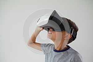 Schoolboy using virtual reality headset