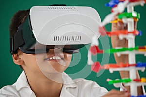 Schoolboy using virtual reality headset in laboratory