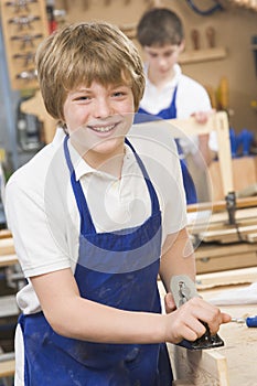 Schoolboy in woodwork class