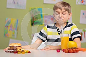 Schoolchild choosing healthy food photo