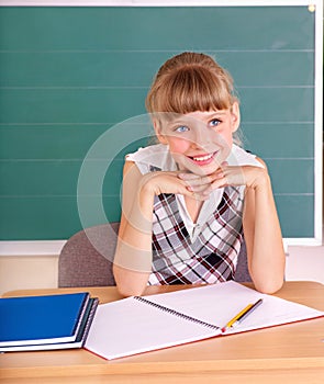 Schoolchild in classroom. photo