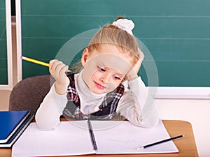 Schoolchild in classroom. photo