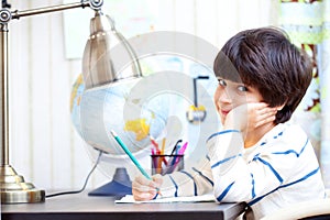 Schoolchild doing homework photo