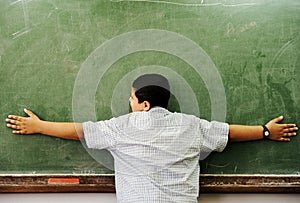 Schoolchild hugging board