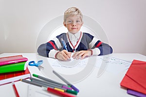 Schoolchild at the sweater doing wordsearch photo
