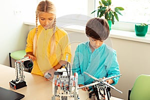 Schoolchildren building robots during their science class.