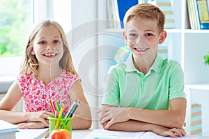 Schoolchildren are came back to school and learning at the table