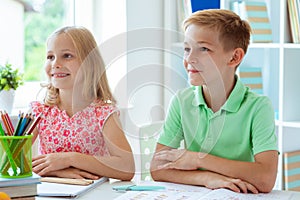 Schoolchildren are came back to school and learning at the table