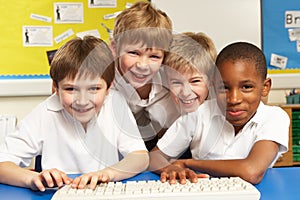 Schoolchildren in IT Class Using Computers photo