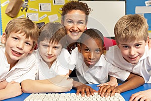 Schoolchildren in IT Class Using Computers photo