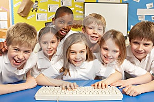 Schoolchildren in IT Class Using Computers photo