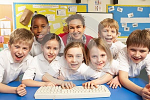 Schoolchildren in IT Class Using Computers photo