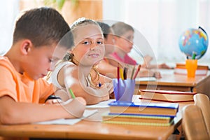 Schoolchildren in classroom at school