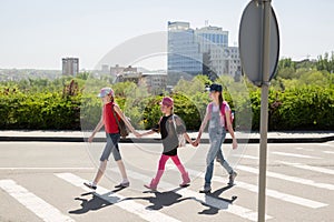 Schoolchildren crossing the road on their way to school.