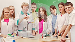 Schoolchildren doing experiment in science class