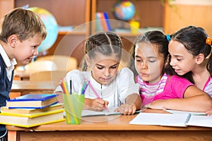 Schoolchildren having fun in classroom