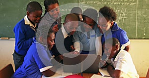 Schoolchildren with laptop in a lesson at a township school 4k