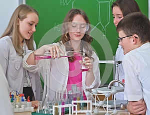 Schoolchildren r in science class