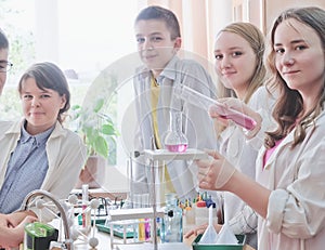 Schoolchildren in science class photo