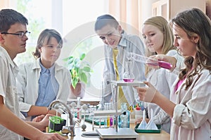 Schoolchildren in science class photo