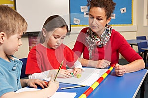 Schoolchildren Studying in classroom