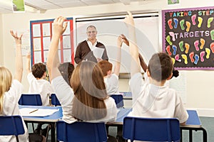 Schoolchildren Studying In Classroom photo