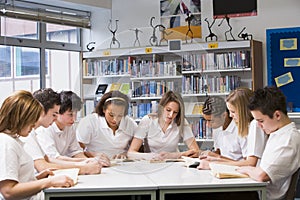 Schoolchildren studying in school library