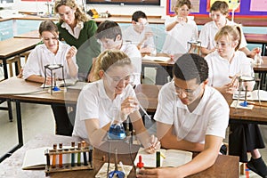 Schoolchildren and teacher in science class