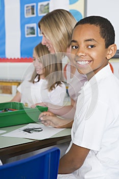 Schoolchildren and their teacher in an art class