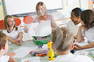 Schoolchildren and their teacher in an art class