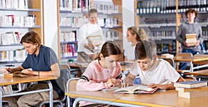 Schoolchildren write out a synopsis from the textbook