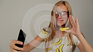 Schooler girl is rotating spinner for selfie