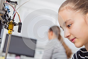 Schoolgirl with 3d printe. education, technology.