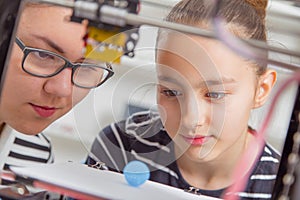 Schoolgirl with 3d printe. education, technology.