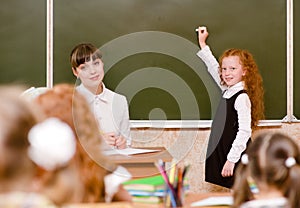 Schoolgirl answers questions of teachers near a school board